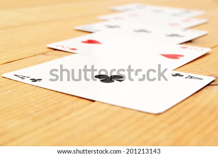 Poker cards on wood