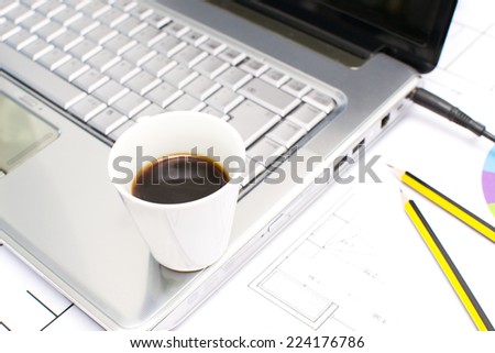 Computer and coffee in the office table