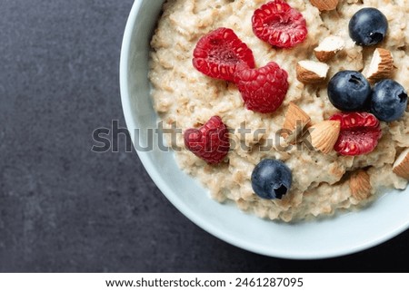 Similar – Image, Stock Photo Bowl of healthy almond chips spilled on wooden table