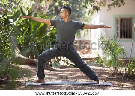 Young man does yoga in nature./Yoga in nature.