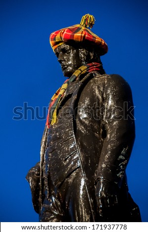 The statue of Robert Burns Scottish poet in George Square Glasgow dressed for the annual Burns Night celebration in January