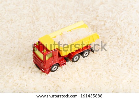Dump truck toy transported rice grains (installation on the theme of agriculture business)
