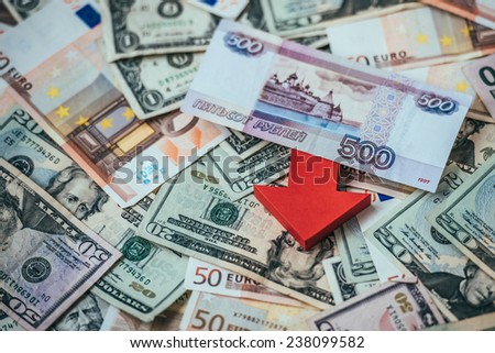 Banknotes of russian roubles on us dollars and european euros.