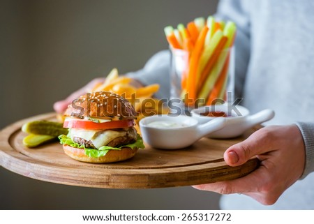 Lunch menu with small burger, french fries and vegetable sticks