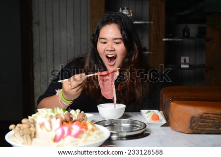 Woman eating pork