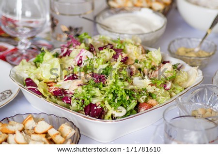 Caesar Salad with a chicken and green lettuce leaves