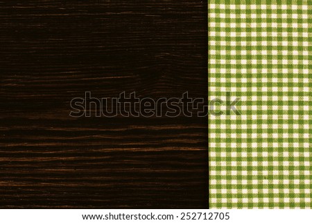 Checkered Tablecloth On The Wooden Background./ Checkered Tablecloth On The Wooden Background.