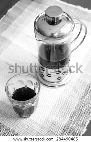 black and white of french press coffee