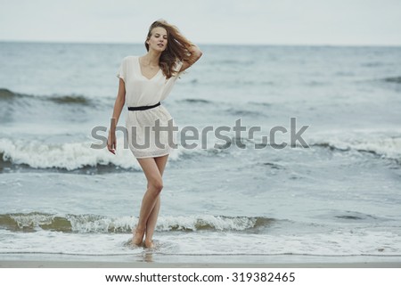 beautiful sensual girl in cold water portrait