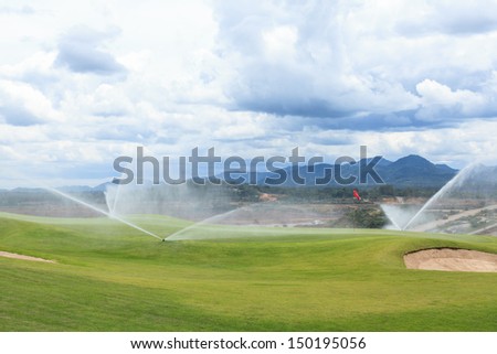 sprinklers on golf course at mae-moe mine