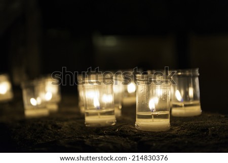 Candles burning on a wall during the \'Concert of the Candles\' night in Pedraza, Segovia. Shallow DOF