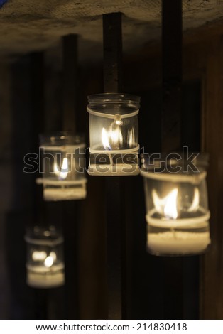 Candles burning on a window during the \'Concert of the Candles\' night in Pedraza, Segovia. Shallow DOF