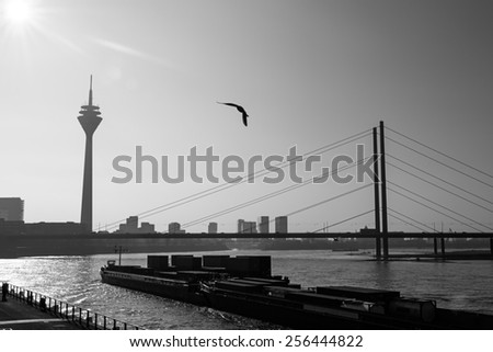 Late afternoon in Dusseldorf, Germany, with the silhouettes of the Rheinturm Tower and the Media Harbour.
