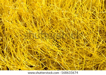 worn broom bristles yellow texture macro