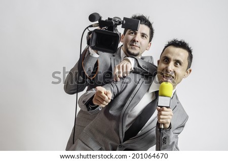 Two men with camera and microphone