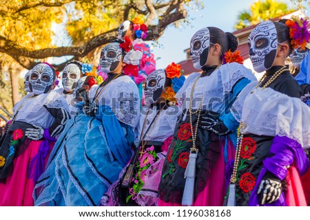 Group of unrecognizable women wearing traditional sugar skull masks and costumes for Dia de los Muertos celebration Foto stock © 