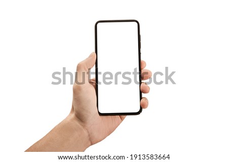 Man hand holding the black cell phone smartphone with blank white screen and modern frame less design - isolated on white background. Mockup phone. hand holding mobile phone
