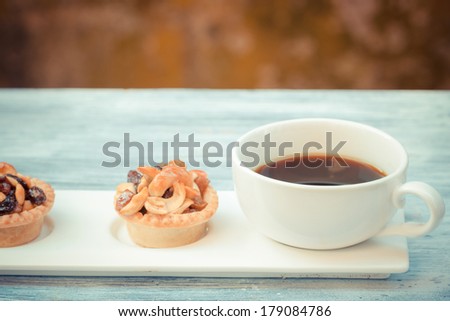 vintage black coffee and Fruit Tart  on wooden table