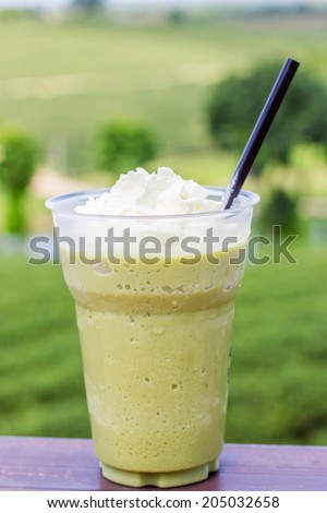 Ice green tea smoothies on tea plantation blackguard