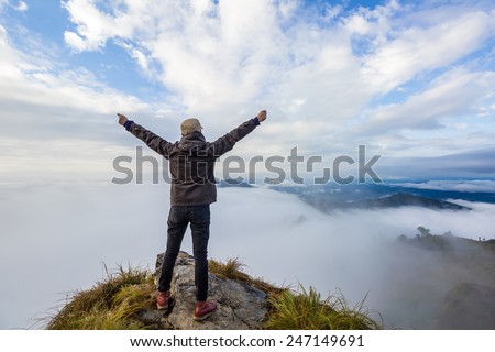 Man on top of mountain. Phu cheefa park Chiangrai, Thailand.