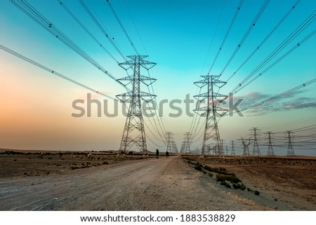 High voltage electric tower on sunset time near Al Hofuf -Saudi Arabia.
