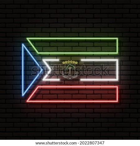 Neon sign in the form of the flag of Equatorial Guinea. Against the background of a brick wall with a shadow. For the design of tourist or patriotic themes. The African continent