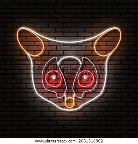 The Senegal bushbaby, Galago senegalensis, the head of an animal in the form of a neon sign. Vector image. Against the background of a brick wall with a shadow.