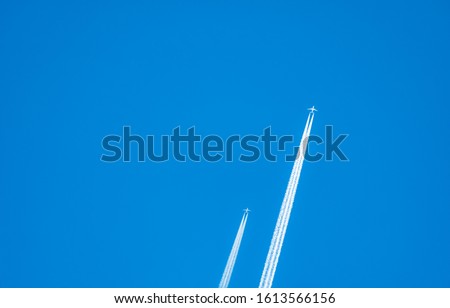 Similar – Image, Stock Photo Condensing stripes in the blue sky over Germany