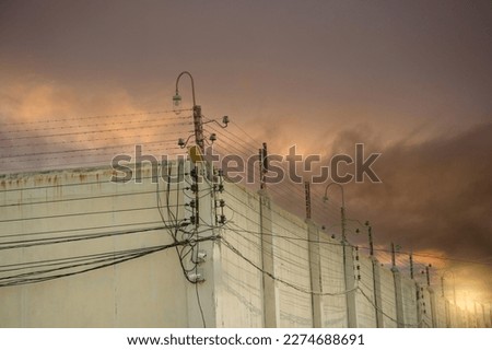 Similar – Image, Stock Photo barbed wire and concrete military fence on the beach near the sea in Crimea