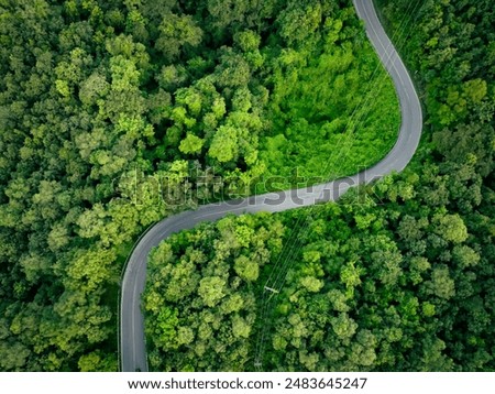 Similar – Image, Stock Photo Aerial drone view of road in idyllic winter landscape at sunset. Street running through the nature from a birds eye view