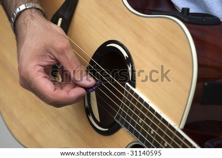 Tune the guitar