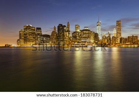 The Manhattan skyline in New York City at night including the new One World Trade Center.