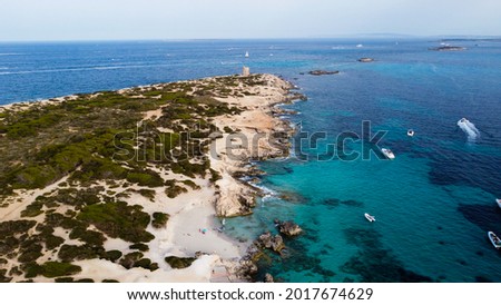 Aerial view of Punta de sa Torre de Ses Portes, a sandy point in the south of Ibiza island in Spain with a medieval round defensive tower Foto stock © 