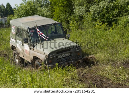 Lvov, Ukraine - May 30, 2015: Off-road vehicle UAZ (No. 306) overcomes the track on  of   landfill near the city  Lvov, Ukraine.