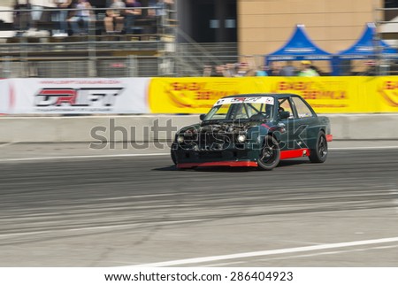Lvov, Ukraine - June 6, 2015: Unknown rider on the car brand BMW overcomes the track in the championship of Ukraine drifting in Lvov, Ukraine.