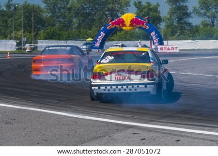 Lvov, Ukraine - June 7, 2015: Unknown riders on the car brand Nissan and BMW overcomes the track in the championship of Ukraine drifting in Lvov, Ukraine
