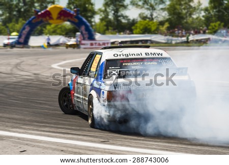 Lvov, Ukraine - June 7, 2015: Unknown riders on the cars brand  Nissan overcomes the track in the championship of Ukraine drifting in Lvov, Ukraine.