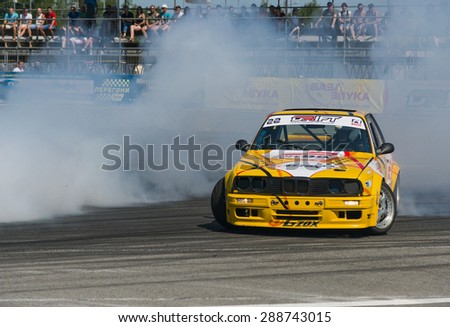 Lvov, Ukraine - June 7, 2015: Unknown riders on the cars brand  Nissan overcomes the track in the championship of Ukraine drifting in Lvov, Ukraine.