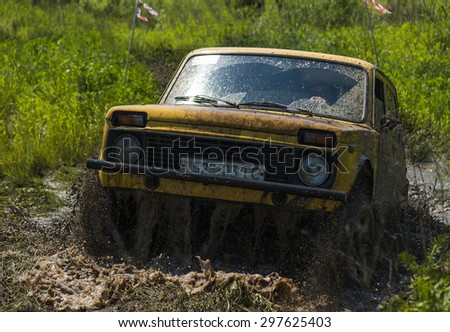 Lvov, Ukraine - May 30, 2015: Off-road vehicle VAZ-NIVA (No. 710) overcomes the track on of landfill near the city Lvov.