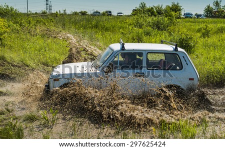 Lvov, Ukraine - May 30, 2015: Off-road vehicle VAZ-NIVA (No. 333) overcomes the track on of landfill near the city Lvov.