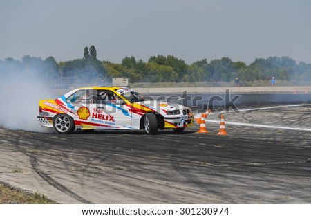 Vinnytsia,Ukraine-July 24, 2015: Rider V. Borovitsky  on the car brand BMW   makes a mistake on the track in the  Drift championship of Ukraine  on July 24,2015 in Vinnytsia, Ukraine.