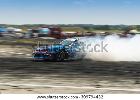 Vinnytsia,Ukraine-July 25, 2015: Unknown on the car brand Nissan overcomes the track in the Drift championship of Ukraine on July 25,2015 in Vinnytsia, Ukraine.