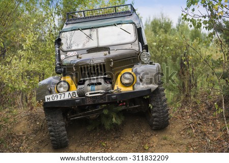 Lviv, Ukraine - August 23, 2015: Off-road vehicle brand GAZ-69 (UAZ) overcomes the track on of sandy career near the city Lviv, Ukraine.