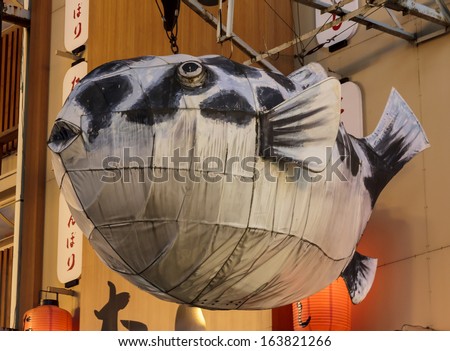 Osaka, Japan - June 20, 2010: A giant fish billboard in Dotombori on  June 20, 2010 in Osaka, Japan. Dotombori is the most important restaurant district and a major tourist destination in Osaka.