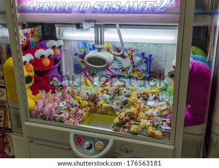 Osaka, Japan - June 20, 2010: A street claw crane game machine in Dotombori district on June 20, 2010. Claw crane game machines are a frequent sight in japanese cities.