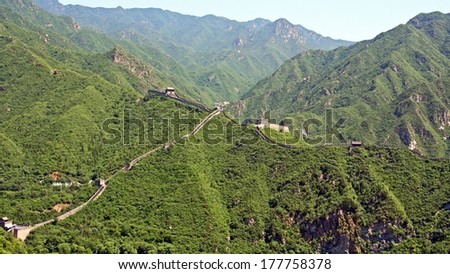 A fragment  of restored Ming dynasty fortress at Juyongguan, north of Beijing against the background of green mountains
