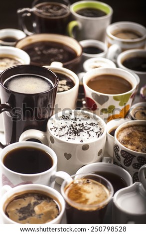 Lots of coffee in different cups with hearts.