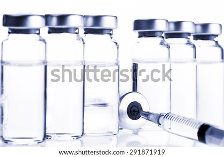 Glass Medicine Vials and botox hualuronic collagen or flu syringe. Tinted image.