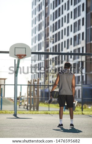 Similar – Image, Stock Photo Confident basketball player standing on playground