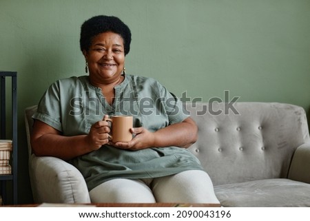 Similar – Image, Stock Photo Woman sitting at home with cat